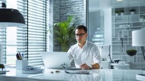 Identify Common Pests in Coral Gables Effectively 4 a professional pest control technician in a modern office environment, equipped with advanced extermination tools and focused on applying effective treatments in a clean, organized space, conveys the urgency and expertise of emergency roach eradication services.